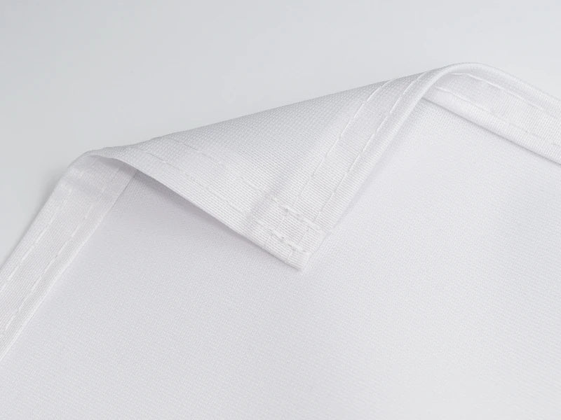 Close-up of a folded textile banner edge with double stitching